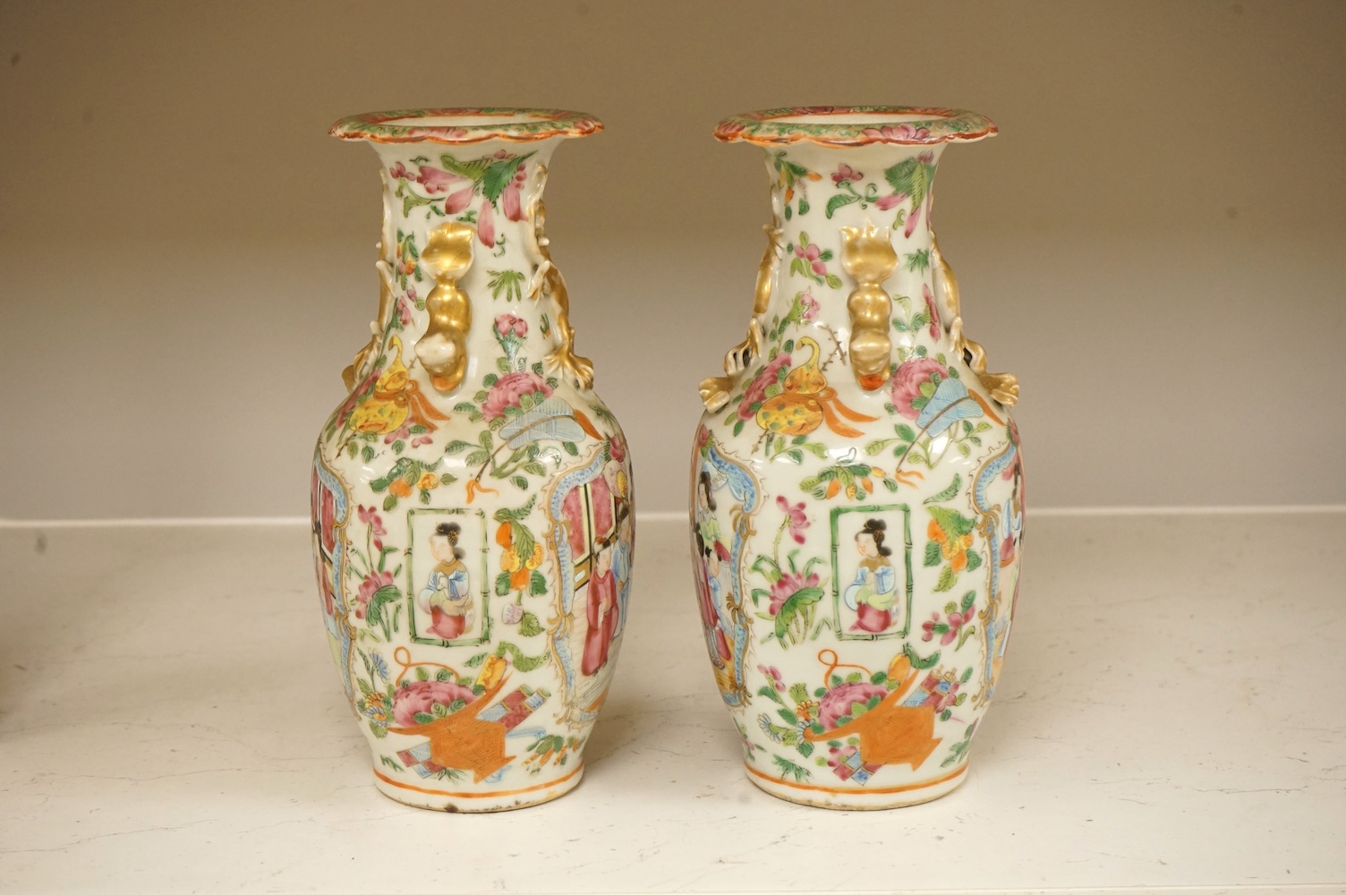 A pair of 19th century Chinese famille rose vases, 24cm